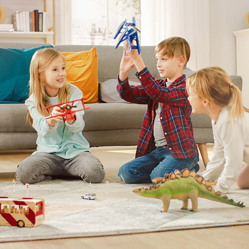 Kids playing in living room with toys | Howmar Carpet Inc