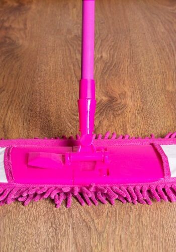 Soft mop sweeping laminate flooring | Howmar Carpet Inc